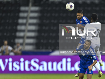 Mousa Farawi (C) of Palestine battles for the ball with Fahad Alhajeri of Kuwait during the FIFA World Cup 2026 Qualification 3rd Round grou...