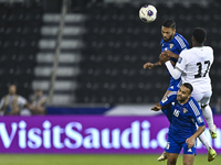 Mousa Farawi (C) of Palestine battles for the ball with Fahad Alhajeri of Kuwait during the FIFA World Cup 2026 Qualification 3rd Round grou...