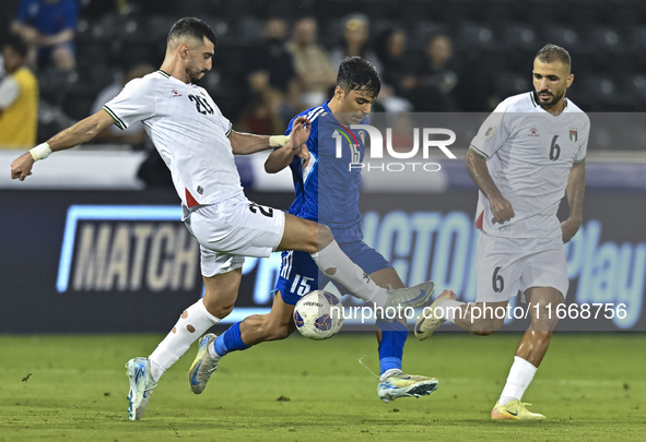 Ameed Mahajneh of Palestine battles for the ball with Yosef Alshammari of Kuwait during the FIFA World Cup 2026 Qualification 3rd Round grou...