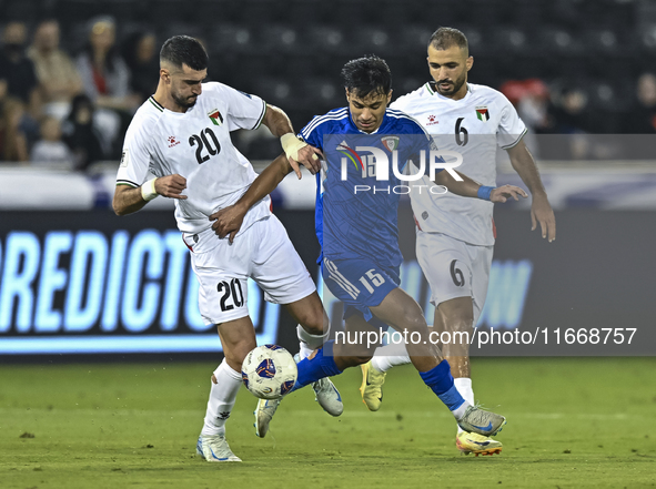 Ameed Mahajneh of Palestine battles for the ball with Yosef Alshammari of Kuwait during the FIFA World Cup 2026 Qualification 3rd Round grou...