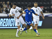 Ameed Mahajneh of Palestine battles for the ball with Yosef Alshammari of Kuwait during the FIFA World Cup 2026 Qualification 3rd Round grou...