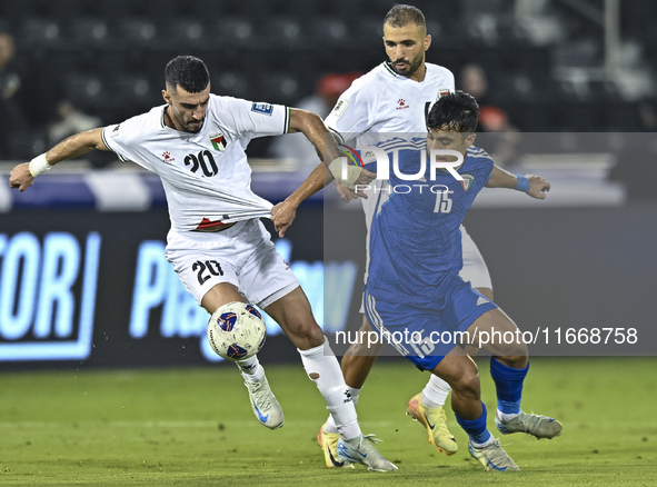 Ameed Mahajneh of Palestine battles for the ball with Yosef Alshammari of Kuwait during the FIFA World Cup 2026 Qualification 3rd Round grou...