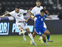 Ameed Mahajneh of Palestine battles for the ball with Yosef Alshammari of Kuwait during the FIFA World Cup 2026 Qualification 3rd Round grou...