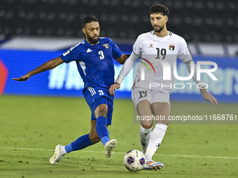 Wessam Abouli of Palestine battles for the ball with Meshari Alenezi of Kuwait during the FIFA World Cup 2026 Qualification 3rd Round group...