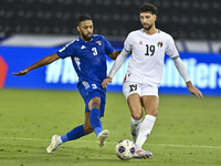 Wessam Abouli of Palestine battles for the ball with Meshari Alenezi of Kuwait during the FIFA World Cup 2026 Qualification 3rd Round group...