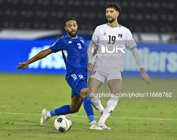 Wessam Abouli of Palestine battles for the ball with Meshari Alenezi of Kuwait during the FIFA World Cup 2026 Qualification 3rd Round group...