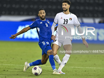 Wessam Abouli of Palestine battles for the ball with Meshari Alenezi of Kuwait during the FIFA World Cup 2026 Qualification 3rd Round group...