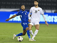 Wessam Abouli of Palestine battles for the ball with Meshari Alenezi of Kuwait during the FIFA World Cup 2026 Qualification 3rd Round group...