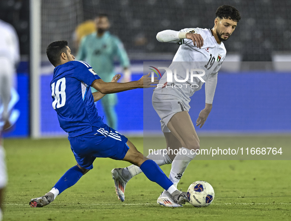 Wessam Abouli of Palestine battles for the ball with Athbi Saleh of Kuwait during the FIFA World Cup 2026 Qualification 3rd Round group B ma...