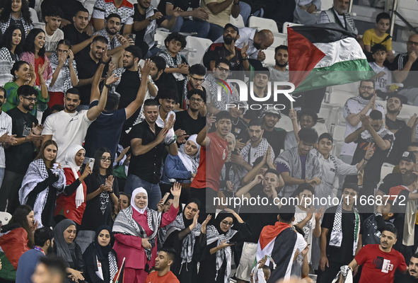 Fans of Palestine cheer during the FIFA World Cup 2026 Qualification 3rd Round group B match between Palestine and Kuwait at Jassim Bin Hama...