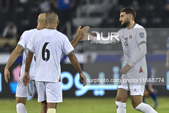 Zeid Qunbar of Palestine celebrates with his teammates after scoring a goal during the FIFA World Cup 2026 Qualification 3rd Round group B m...