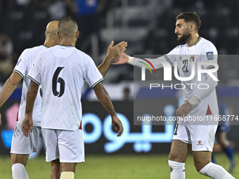 Zeid Qunbar of Palestine celebrates with his teammates after scoring a goal during the FIFA World Cup 2026 Qualification 3rd Round group B m...