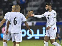 Zeid Qunbar of Palestine celebrates with his teammates after scoring a goal during the FIFA World Cup 2026 Qualification 3rd Round group B m...