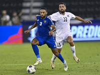 Oday Dabbagh of Palestine battles for the ball with Meshari Alenezi of Kuwait during the FIFA World Cup 2026 Qualification 3rd Round group B...