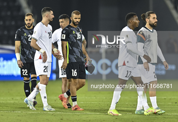 Players of Palestine react after the FIFA World Cup 2026 Qualification 3rd Round group B match between Palestine and Kuwait at Jassim Bin Ha...