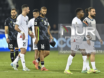 Players of Palestine react after the FIFA World Cup 2026 Qualification 3rd Round group B match between Palestine and Kuwait at Jassim Bin Ha...