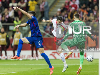 Josip Sutalo , Robert Lewandowski , Dominik Livakovic  during UEFA Nations League match Poland vs Croatia in Warsaw Poland on 15 October 202...