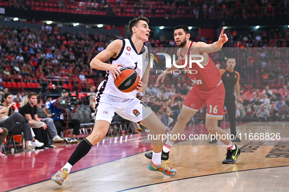 Neno Dimitrijevic of EA7 Emporio Armani Milan competes with Kostas Papanikolaou of Olympiacos Piraeus during the Euroleague, Round 3 match b...