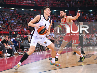 Neno Dimitrijevic of EA7 Emporio Armani Milan competes with Kostas Papanikolaou of Olympiacos Piraeus during the Euroleague, Round 3 match b...