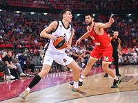 Neno Dimitrijevic of EA7 Emporio Armani Milan competes with Kostas Papanikolaou of Olympiacos Piraeus during the Euroleague, Round 3 match b...