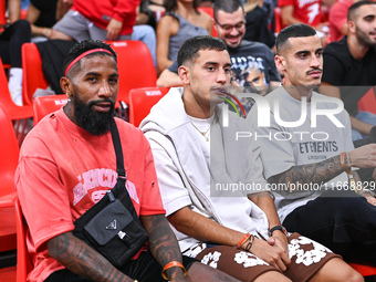 Rodinei, Santiago Hezze, and Chiquinho of the Olympiacos Piraeus football team participate in the Euroleague, Round 3 match between Olympiac...