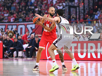 Evan Fournier of Olympiacos Piraeus competes with Leandro Bolmaro of EA7 Emporio Armani Milan during the Euroleague, Round 3 match between O...