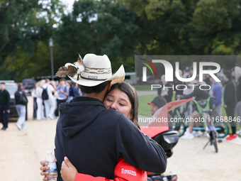 A woman is comforted by someone after Indigenous demonstrators clash with police near the U.S. Capitol in Washington, D.C. on October 15, 20...