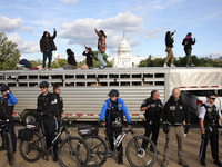 Police surround a horse trailer after Indigenous demonstrators clash with police near the U.S. Capitol in Washington, D.C. on October 15, 20...