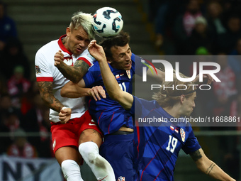 Kamil Piatkowski of Poland, Ante Budimir and Borna Sosa of Croatia during UEFA Nations League football match Poland - Croatia at National St...