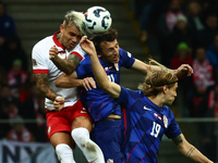 Kamil Piatkowski of Poland, Ante Budimir and Borna Sosa of Croatia during UEFA Nations League football match Poland - Croatia at National St...