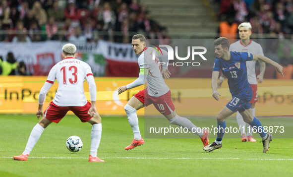 Jakub Kaminski , Piotr Zielinski , Petar Sucic  during UEFA Nations League match Poland vs Croatia in Warsaw Poland on 15 October 2024. 