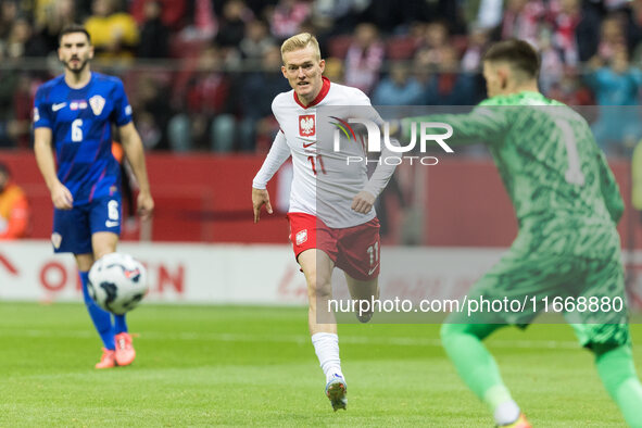 Karol Swiderski , Dominik Livakovic  during UEFA Nations League match Poland vs Croatia in Warsaw Poland on 15 October 2024. 