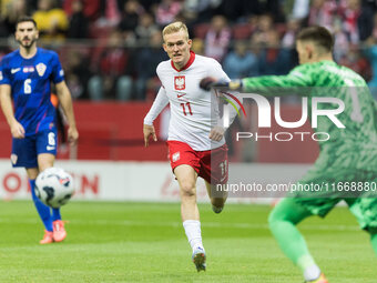 Karol Swiderski , Dominik Livakovic  during UEFA Nations League match Poland vs Croatia in Warsaw Poland on 15 October 2024. (