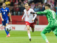 Karol Swiderski , Dominik Livakovic  during UEFA Nations League match Poland vs Croatia in Warsaw Poland on 15 October 2024. (