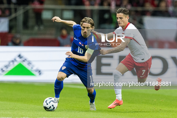 Luka Modric , Kacper Urbanski  during UEFA Nations League match Poland vs Croatia in Warsaw Poland on 15 October 2024. 