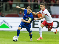 Luka Modric , Kacper Urbanski  during UEFA Nations League match Poland vs Croatia in Warsaw Poland on 15 October 2024. (