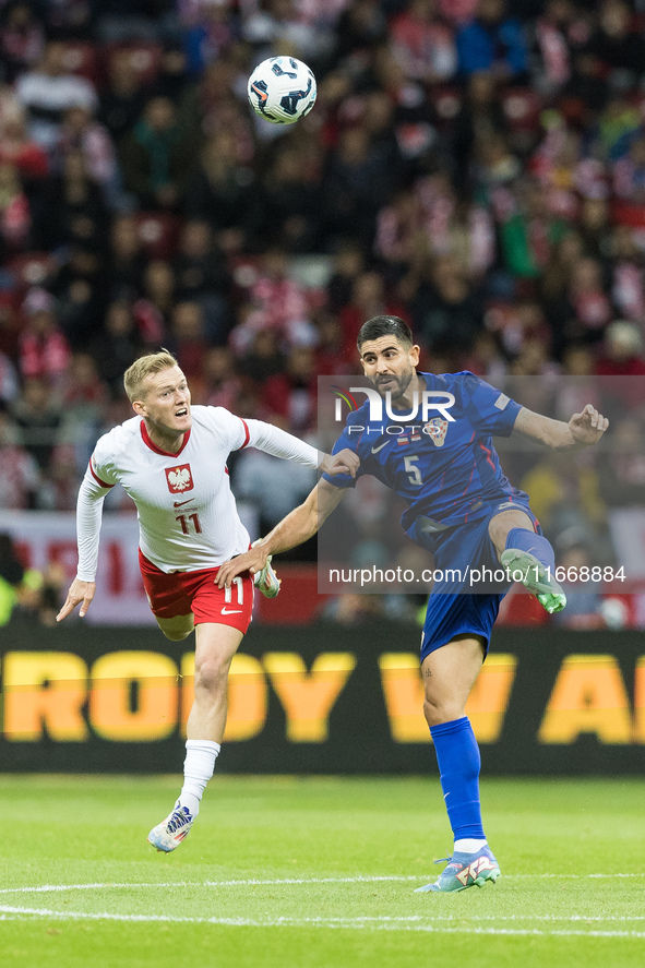 Karol Swiderski , Martin Erlic  during UEFA Nations League match Poland vs Croatia in Warsaw Poland on 15 October 2024. 