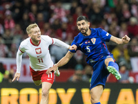 Karol Swiderski , Martin Erlic  during UEFA Nations League match Poland vs Croatia in Warsaw Poland on 15 October 2024. (