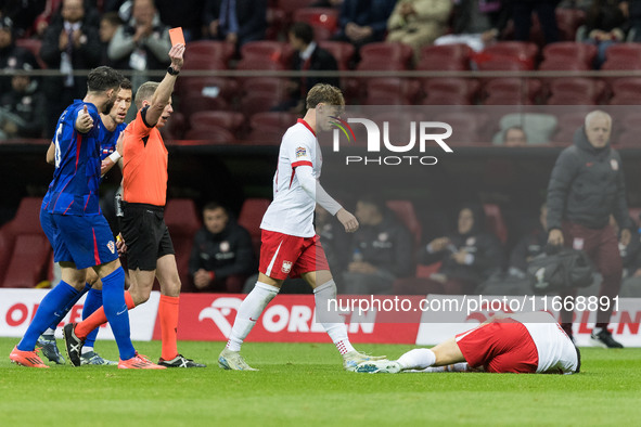 Referee Alejandro Hernandez, red card, Nicola Zalewski , Robert Lewandowski  during UEFA Nations League match Poland vs Croatia in Warsaw Po...