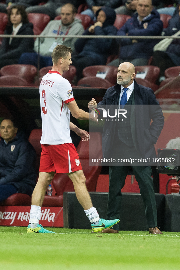 Pawel Dawidowicz , Coach Michal Probierz during UEFA Nations League match Poland vs Croatia in Warsaw Poland on 15 October 2024. 