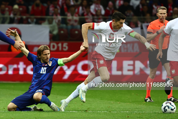 Luka Modric of Croatia and Robert Lewandowski of Poland during UEFA Nations League football match Poland - Croatia at National Stadium in Wa...