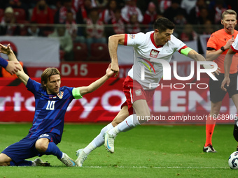 Luka Modric of Croatia and Robert Lewandowski of Poland during UEFA Nations League football match Poland - Croatia at National Stadium in Wa...