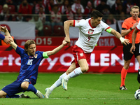 Luka Modric of Croatia and Robert Lewandowski of Poland during UEFA Nations League football match Poland - Croatia at National Stadium in Wa...