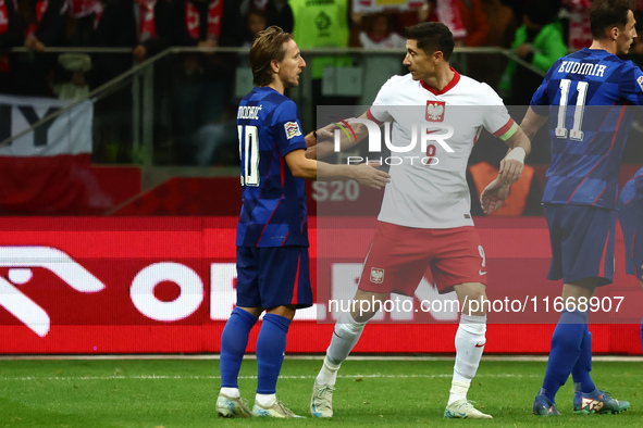 Luka Modric of Croatia and Robert Lewandowski of Poland after UEFA Nations League football match Poland - Croatia at National Stadium in War...