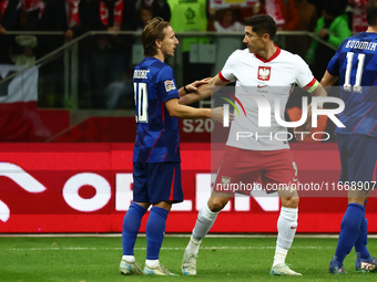 Luka Modric of Croatia and Robert Lewandowski of Poland after UEFA Nations League football match Poland - Croatia at National Stadium in War...