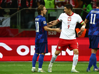 Luka Modric of Croatia and Robert Lewandowski of Poland after UEFA Nations League football match Poland - Croatia at National Stadium in War...