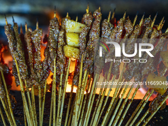 Lamb kebabs are seen at a stall at a night market in Guiyang, China, on August 25, 2024. (