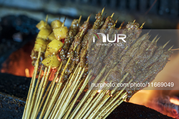 Lamb kebabs are seen at a stall at a night market in Guiyang, China, on August 25, 2024. 