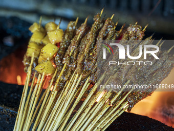 Lamb kebabs are seen at a stall at a night market in Guiyang, China, on August 25, 2024. (