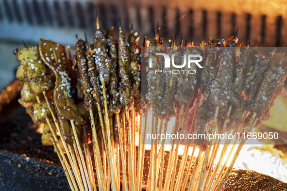 Lamb kebabs are seen at a stall at a night market in Guiyang, China, on August 25, 2024. 